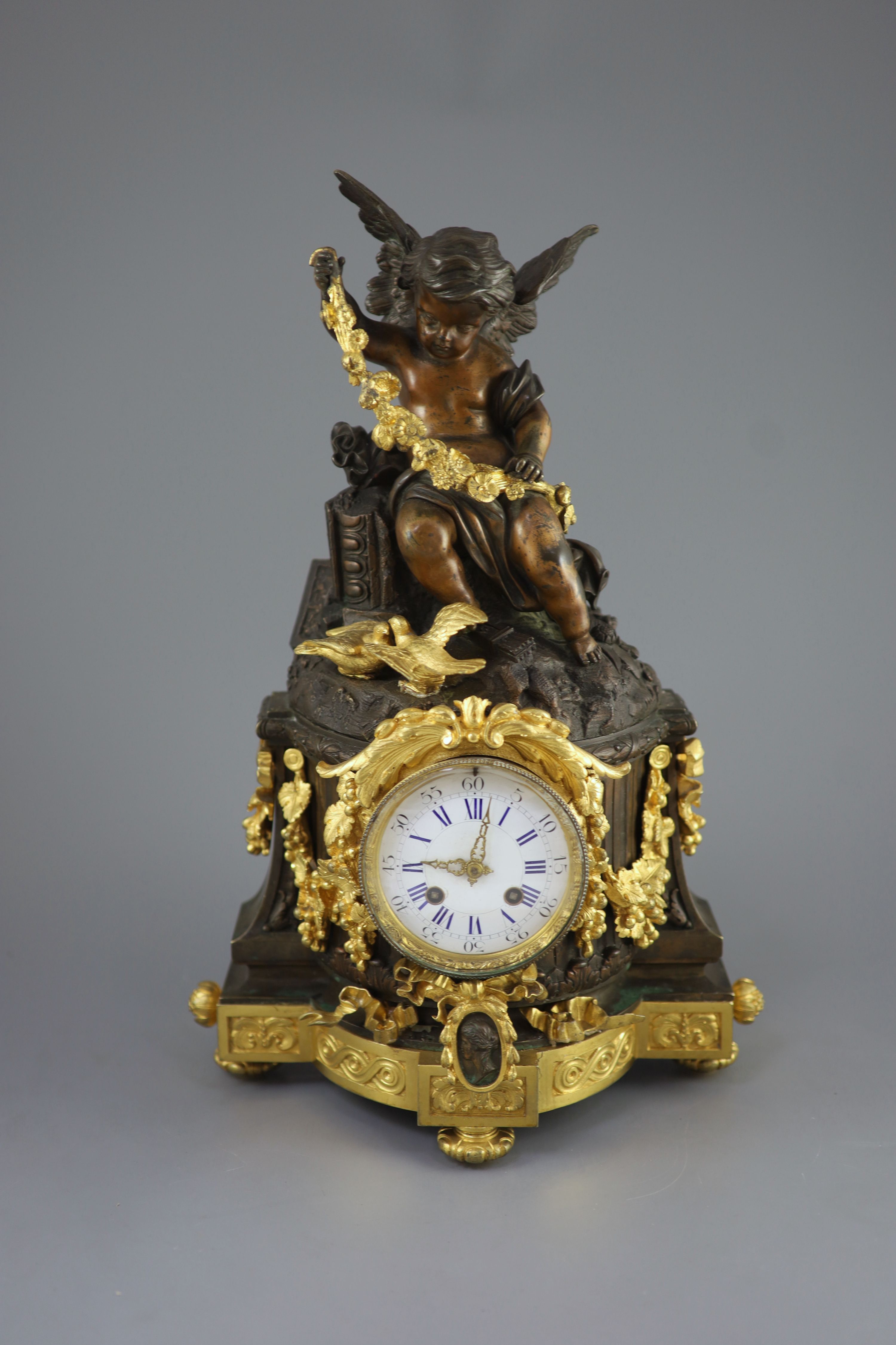 A large French figural bronze and ormolu mantel clock, 19th century 46cm high.